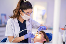 Woman Is Getting Dental Treatment In A Dentist Clinic