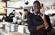 © JackF - African american professional chef male in kitchen of restaurat