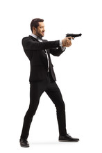 Man In A Suit Aiming With A Gun