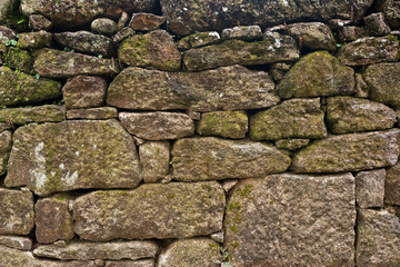 Texture of a stone wall. Old castle stone wall background. Wall made of wild stone. Natural background.