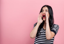 Young Woman Shouting On A Pink Background