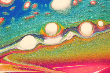 Fun, colorful abstract background with metallic teal creating a rainbow alien dreamscape.