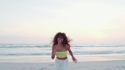 Wall Mural - Black beautiful attractive afro young cute girl, curly hair, bikini, famous beach Rio de Janeiro, Brazil. Latin summer vacation holiday. Cinematic 4K.