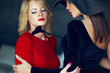 Blonde woman in red with lesbian lover portrait