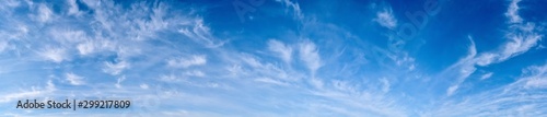 Panorama of a blue sky with white clouds as a backround © John Smith