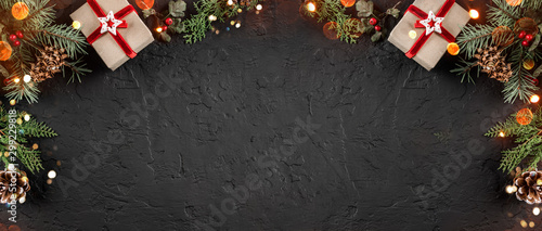 Christmas gift boxes on holiday background with Fir branches, pine cones Poster Mural XXL