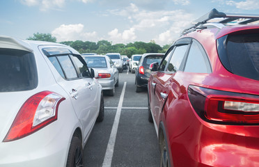 Cars parked on asphalt parking lot background, rear car