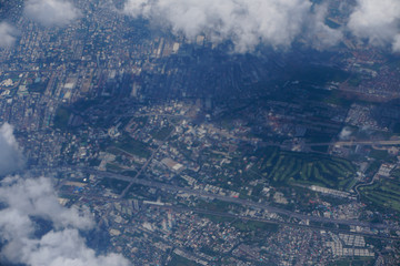 Wall Mural - The aerial view of city through the cloud     