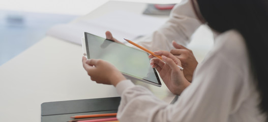 Canvas Print - cropped shot of two professional business partner discussing their project together