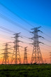 © ABCDstock - High voltage electricity tower sky sunset landscape,industrial background.