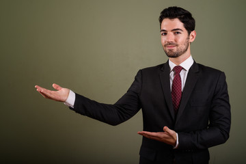 Wall Mural - Portrait of young handsome businessman in suit