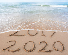New Year 2020 Is Coming Concept. Happy New Year 2020 Replace 2019 Concept On The Sea Beach