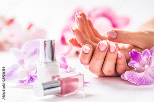 Fényképezés Beautiful nail manicure with decoration from pink orchid