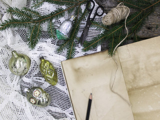 Christmas still life on an old dark wooden background top view. Spruce branches, vintage Christmas tree toys, Free space for the inscription. Concept of winter holidays, Christmas card, background, sc