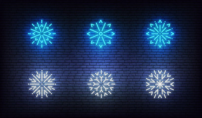Wall Mural - Snow neon icons. Vector glowing neon blue snowflake icons