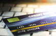 © nukies1234 - Credit cards close up shot on the keyboard with selective focus for background.Concept of shopping on line.