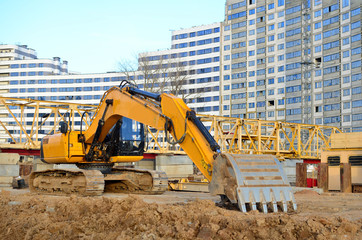 Poster - Excavator digs the ground for the foundation and construction of a new building. Road repair, asphalt replacement, renovating a section of a highway, laying or replacement of underground sewer pipes