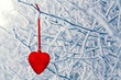 Heart shaped Christmas decorations on branches covered with ice and snow as background, space for text