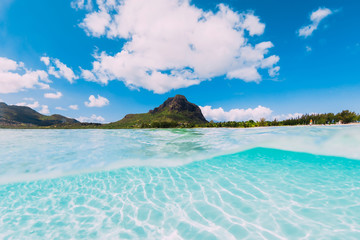 Tropical clear ocean with white sand near Le Morne mountain in Mauritius.