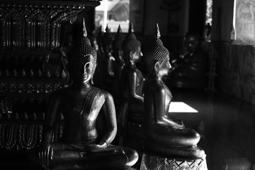 Golden statue of buddha in temple, Thailand