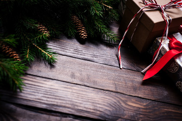 Christmas card close-up, fir tree with cones and gifts