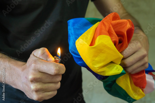 Man Burning Lgbt Flag With A Cigarette Lighter Stock Photo Adobe Stock
