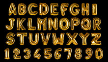 Set with golden foil balloons in shape of letters and numbers on black background