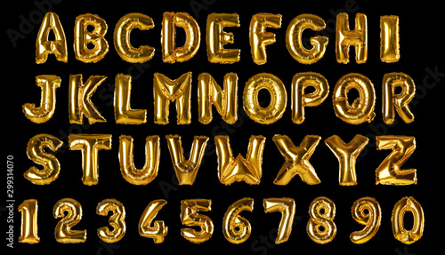 Photographie Set with golden foil balloons in shape of letters and numbers on black backgroun