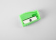 © New Africa - Modern green pencil sharpener on white background