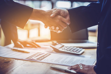 lawyers and businessmen join hands in business after signing the legal consultancy contract