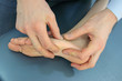 hands touching foot - manual theraphy - osteopathy -massage