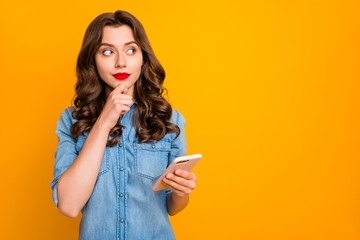 Wall Mural - photo of pensive pondering thinking girlfriend touching her chin holding telephone with hands consid