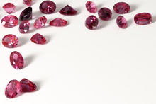 Colorful Red And Pink Ruby Gemstones On White Background