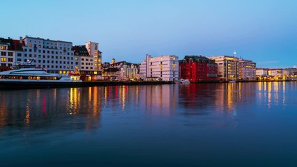 Wall Mural - Bergen, Norway. View of harbour modern buildings in Bergen, Norway during the sunrise. Famous landmarks in the morning. Time-lapse with boats