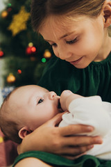 Wall Mural - selective focus of adorable child holding cute little sister