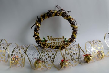 Christmas gold decorations - ribbon and christmas wreath.