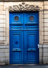 Typical Design Style Of Large Antique Blue Wooden Door On The Streets Of Paris France.