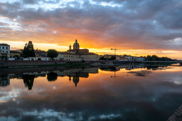 Wall Mural - FLORENCE, TUSCANY/ITALY - OCTOBER 19 : View of buildings along the River Arno at dusk  in Florence  on October 19, 2019