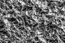 Texture Of Crumpled Aluminum Kitchen Foil. Silver Abstract Background For Design.