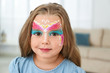 © New Africa - Cute little girl with face painting indoors