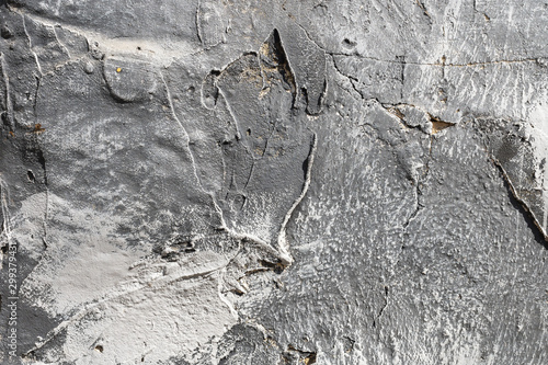 Fotomural The texture of gypsum or alibaster cracked plaster on the wall is a thick layer