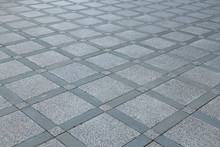 Top View Of Diagonal Grey Diamond Shaped Square Pavement Of Different Sized, Top View. Exterior Design Paving Tile Background.