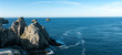© makasana photo - panorama of wild rocky and jagged cliffs and dark blue ocean