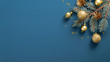Christmas Composition With Green Pine Branch, Golden Decorations And Balls, Confetti On Blue Background With Copy Space. Top View, Flat Lay. Xmas Banner Mockup, Vintage Postcard Template