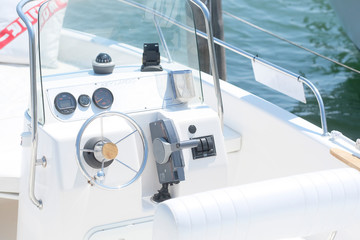 Canvas Print - Garda, Italy - July, 20, 2019:  image of a steering wheel on a motor boat