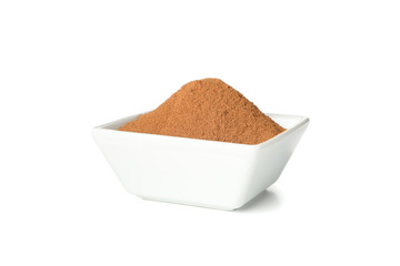 Poster - White sauceboat with cinnamon powder isolated on white background