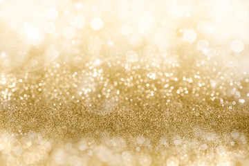 Wall Mural - golden christmas background with sparkling and twinkling bokeh