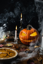 Halloween Table With Jack O Lantern, Spider Web, Candles And Smoke