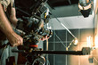 © Georgii - Behind the scenes of filming films or video products and the film crew of the film crew on the set in the pavilion of the film studio.