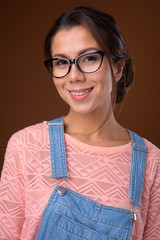 Wall Mural - Portrait of beautiful multi ethnic nerd woman with eyeglasses